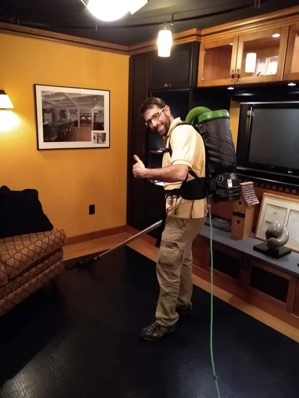 Carfagno Commercial Cleaning team member vacuuming a commercial office in the Indian Valley